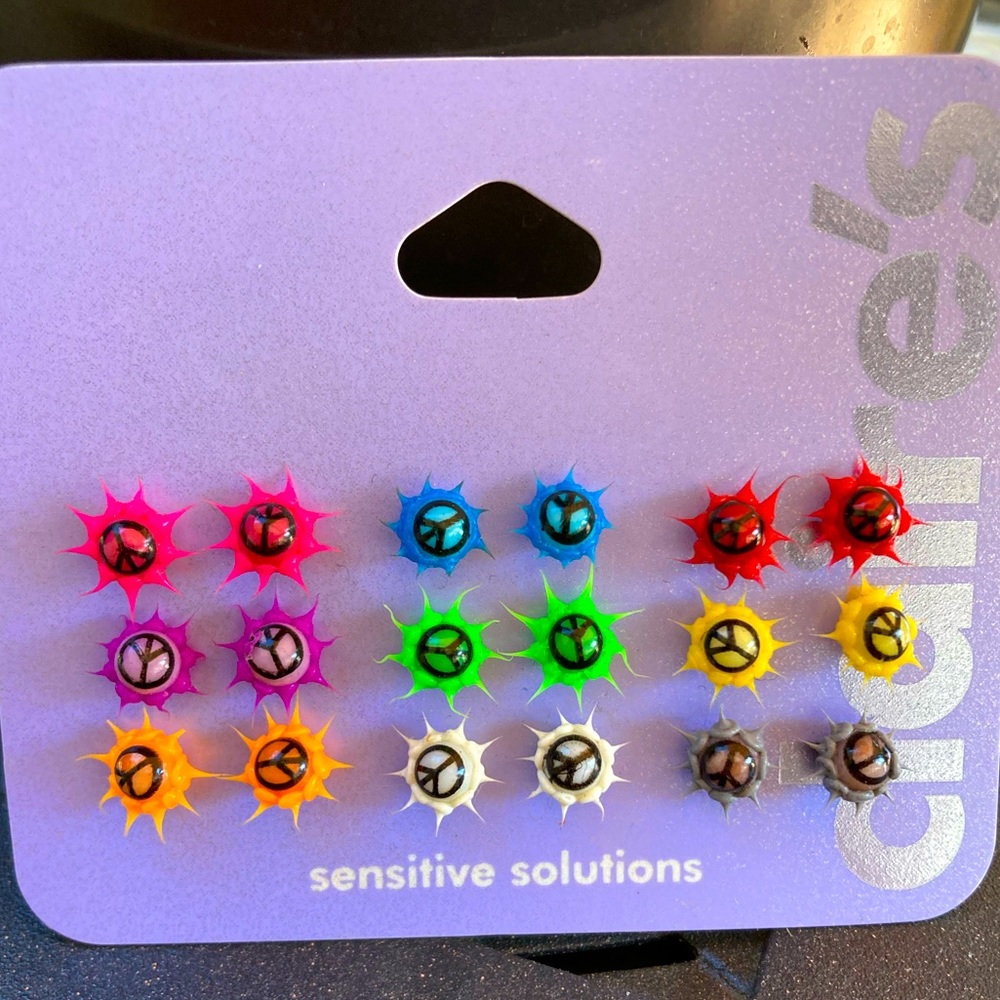 Stud peace sign soft spike earrings. 9 pairs.